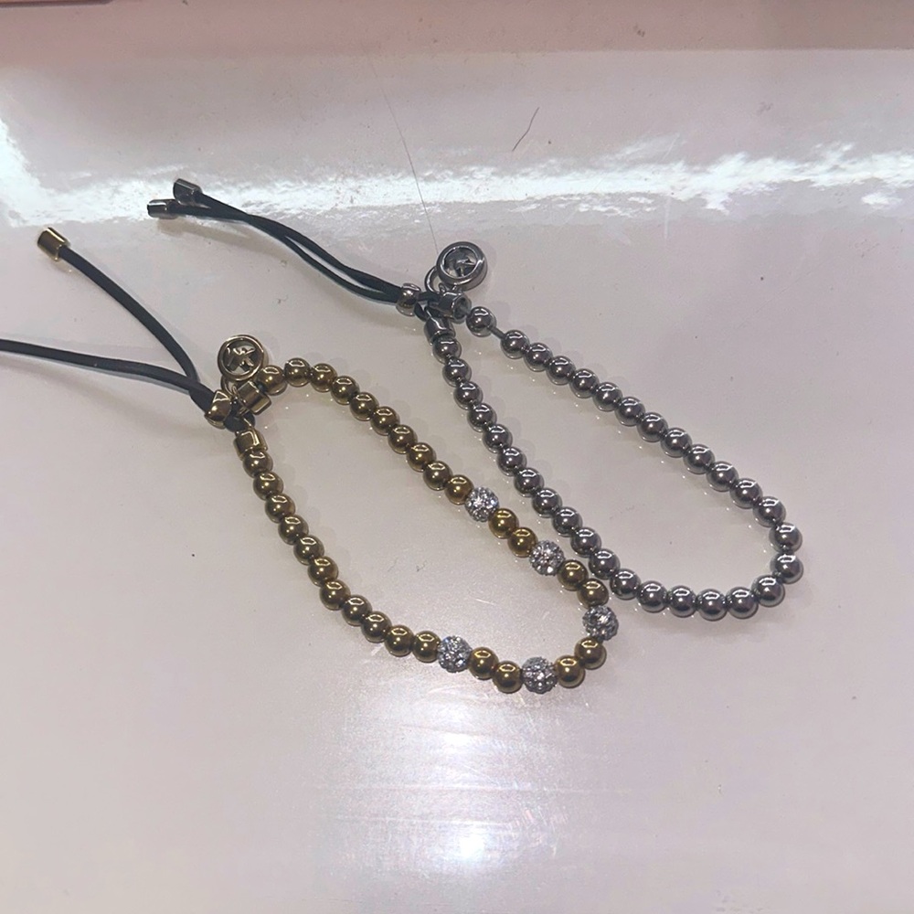 Two Michael Kors bracelets